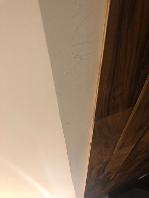 Transitioning between vaulted wood ceiling and regular drywall ceiling