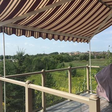 Retractable awning on 2nd level deck with Support Posts