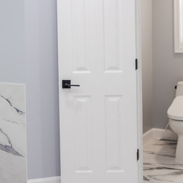 Bathroom remodeling in Columbia, MD with double vanity & marble bathtub