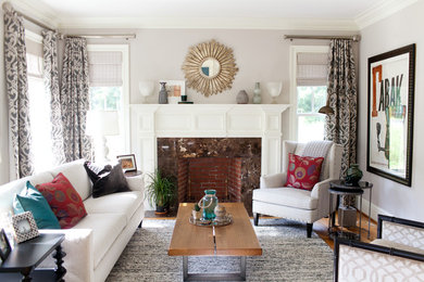 Living room - mid-sized transitional formal and open concept medium tone wood floor and brown floor living room idea in Bridgeport with gray walls, a standard fireplace, a wood fireplace surround and no tv