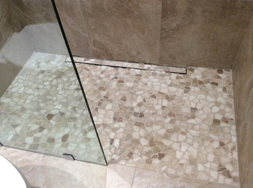 New stone shower floor - seal or not to seal?