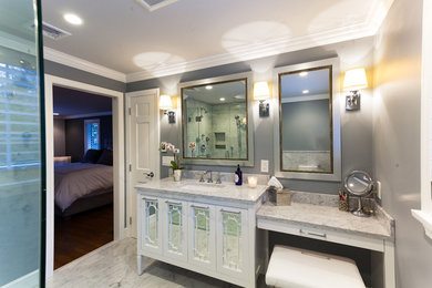 Mid-sized trendy master stone tile marble floor and white floor corner shower photo in Boston with furniture-like cabinets, white cabinets, gray walls, an undermount sink, quartzite countertops and a hinged shower door