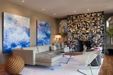 Trendy open concept family room photo in San Francisco with gray walls, a standard fireplace, a stone fireplace and no tv