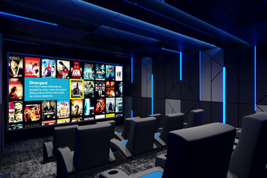 Medium sized modern enclosed home cinema in Essex with blue walls, carpet, a projector screen and black floors.