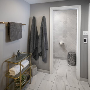 Example of a mid-sized transitional master white tile and porcelain tile porcelain floor and white floor bathroom design in Philadelphia with shaker cabinets, gray cabinets, a wall-mount toilet, gray walls, a drop-in sink, quartzite countertops and white countertops