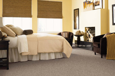 Inspiration for a carpeted bedroom remodel in Other with yellow walls