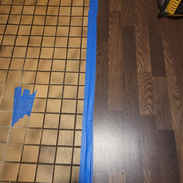 Replacing old broken tile with vinyl wood