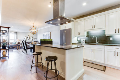 Eat-in kitchen - large rustic single-wall eat-in kitchen idea in Other with a double-bowl sink, white cabinets, granite countertops and an island