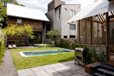 Mid-sized contemporary brown three-story mixed siding exterior home idea in Houston with a shed roof