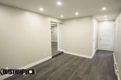 Minimalist basement photo in Montreal