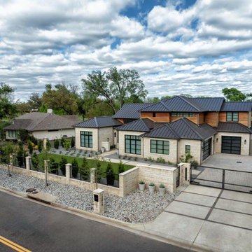 Custom Metal Fence & Electric Driveway Gate with Stone Accents