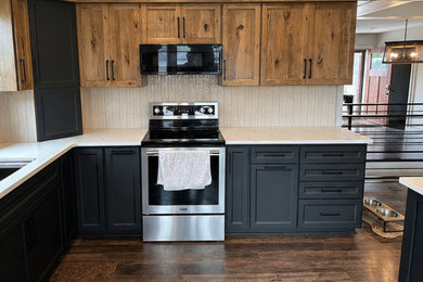 Example of a mid-sized transitional l-shaped eat-in kitchen design in Other with shaker cabinets and quartz countertops