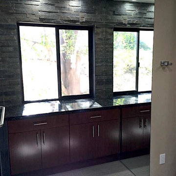 Black Stone and Dark Cabinets - Bathroom Remodeling