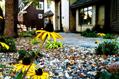 Inspiration for a mid-sized contemporary full sun front yard brick formal garden in Minneapolis.