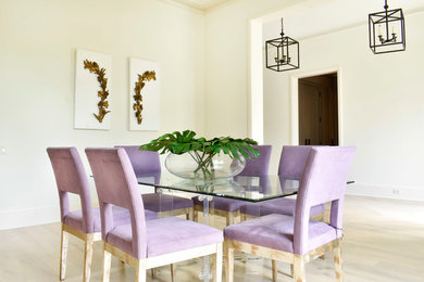 Inspiration for a large modern light wood floor and beige floor enclosed dining room remodel in Houston with white walls and a standard fireplace