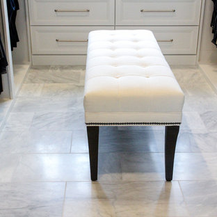 Large midcentury gender-neutral walk-in wardrobe in Other with raised-panel cabinets, white cabinets, marble floors and white floor.