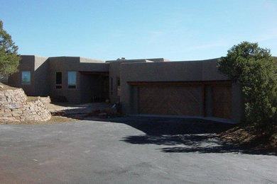 Beige one-story stucco exterior home photo in Albuquerque
