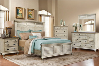 Mid-sized beach style guest medium tone wood floor and white floor bedroom photo in Manchester