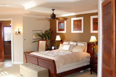 Large island style master carpeted and beige floor bedroom photo in Other with brown walls