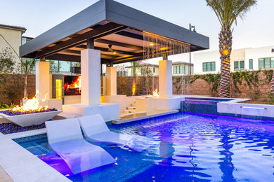 Trendy backyard pool fountain photo in Los Angeles