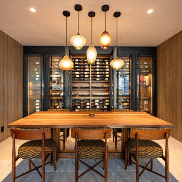 Modern Bronze Steel Wine Wall and Liquor Display in Luxury Custom Home Basement