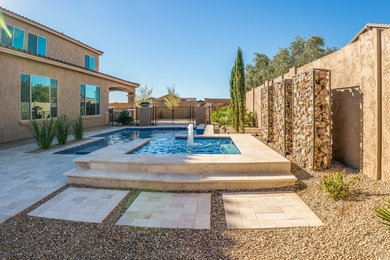 Inspiration for a large full sun backyard gravel water fountain landscape in Phoenix for summer.