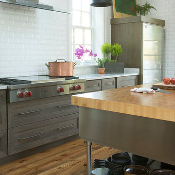 Industrial Kitchen with Stained Wood Cabinetry Stainless Island St. Louis, MO