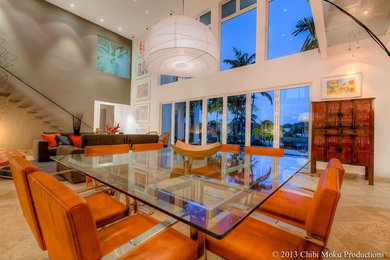 Inspiration for a large contemporary ceramic tile and beige floor great room remodel in Miami with white walls and no fireplace