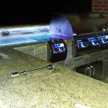L Shaped Outdoor Kitchen With Unique Lighting