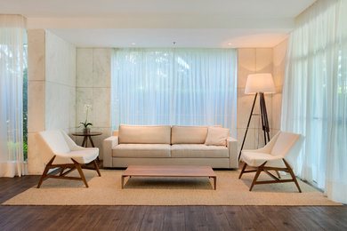 Living room - large modern formal and open concept medium tone wood floor living room idea in Other with white walls