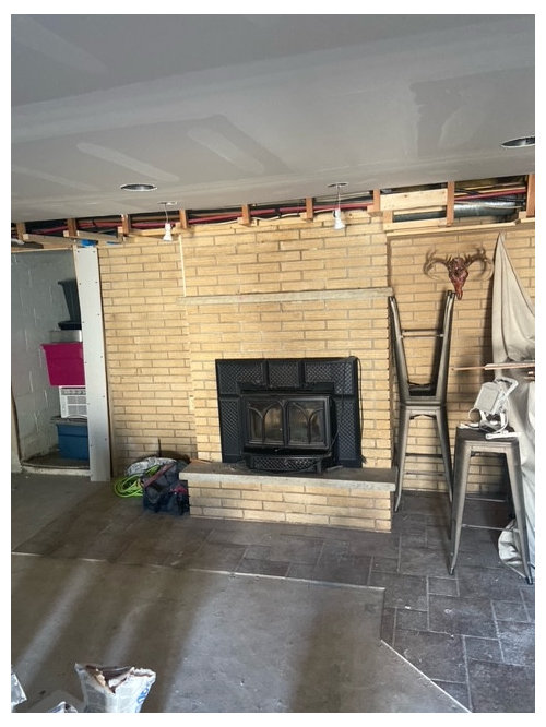 What to do to update this basement fireplace using paint only?