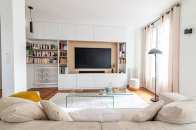 This is an example of a large contemporary living room in Paris with a wall mounted tv.