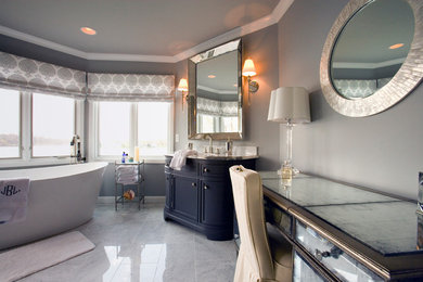 Inspiration for a large timeless master white tile and marble tile marble floor and white floor bathroom remodel in Detroit with beaded inset cabinets, black cabinets, a wall-mount toilet, gray walls, an undermount sink, marble countertops, a hinged shower door and white countertops