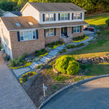 Dual patio with adjoining firepit feature