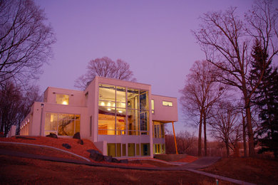 Minimalist gray three-story concrete exterior home photo in Minneapolis