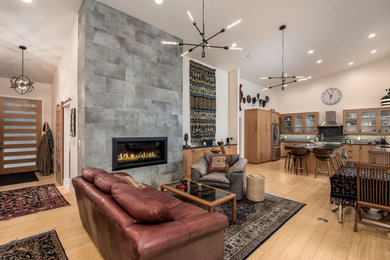 Living room - large 1960s open concept light wood floor and brown floor living room idea in Portland with white walls, a hanging fireplace and a tile fireplace