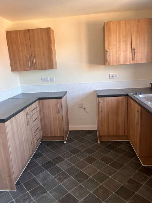 Carpeting 2 bedroom apartment with an open plan kitchen