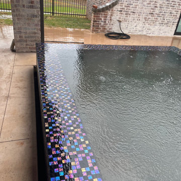 Polymer vinyl liner pool w/concrete spillover spa & automatic pool cover