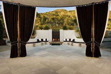 Design ideas for a transitional patio in Santa Barbara with a fire feature.