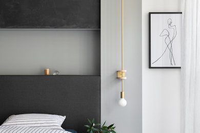 Expansive contemporary master bedroom in Melbourne with grey walls.