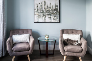 Inspiration for a contemporary medium tone wood floor and brown floor family room remodel in Toronto