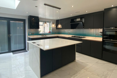 This is an example of a kitchen in Berkshire with an island.