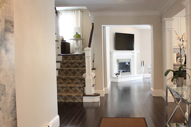 Hallway - large transitional dark wood floor hallway idea in New York with white walls