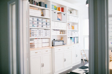 Example of a mid-sized danish freestanding desk home studio design in Houston with white walls