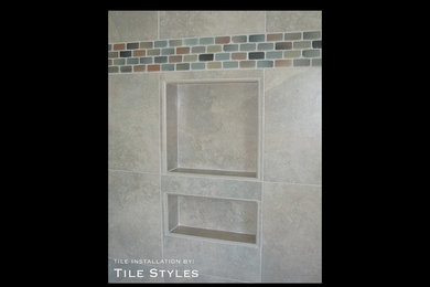 Example of an island style beige tile and porcelain tile tub/shower combo design in Hawaii