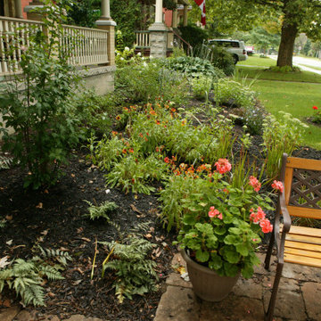 Formal Gardens in Front and Pondless Stream in Backyard