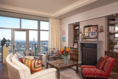 Living room - mid-sized eclectic formal and loft-style medium tone wood floor living room idea in New York with beige walls, a standard fireplace, a concrete fireplace and no tv