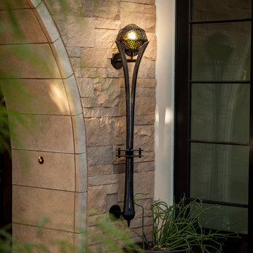 Stone Entryway With Abstract Globe Lighting