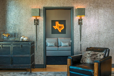 Example of a large transitional open concept light wood floor living room design in Austin with gray walls
