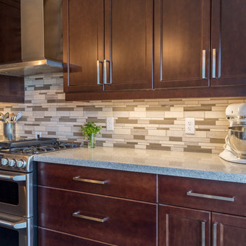 Falsetta - Brown Cabinets with Mosaic Tile Backsplash